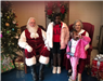 Mr. and Mrs. Santa with two children.