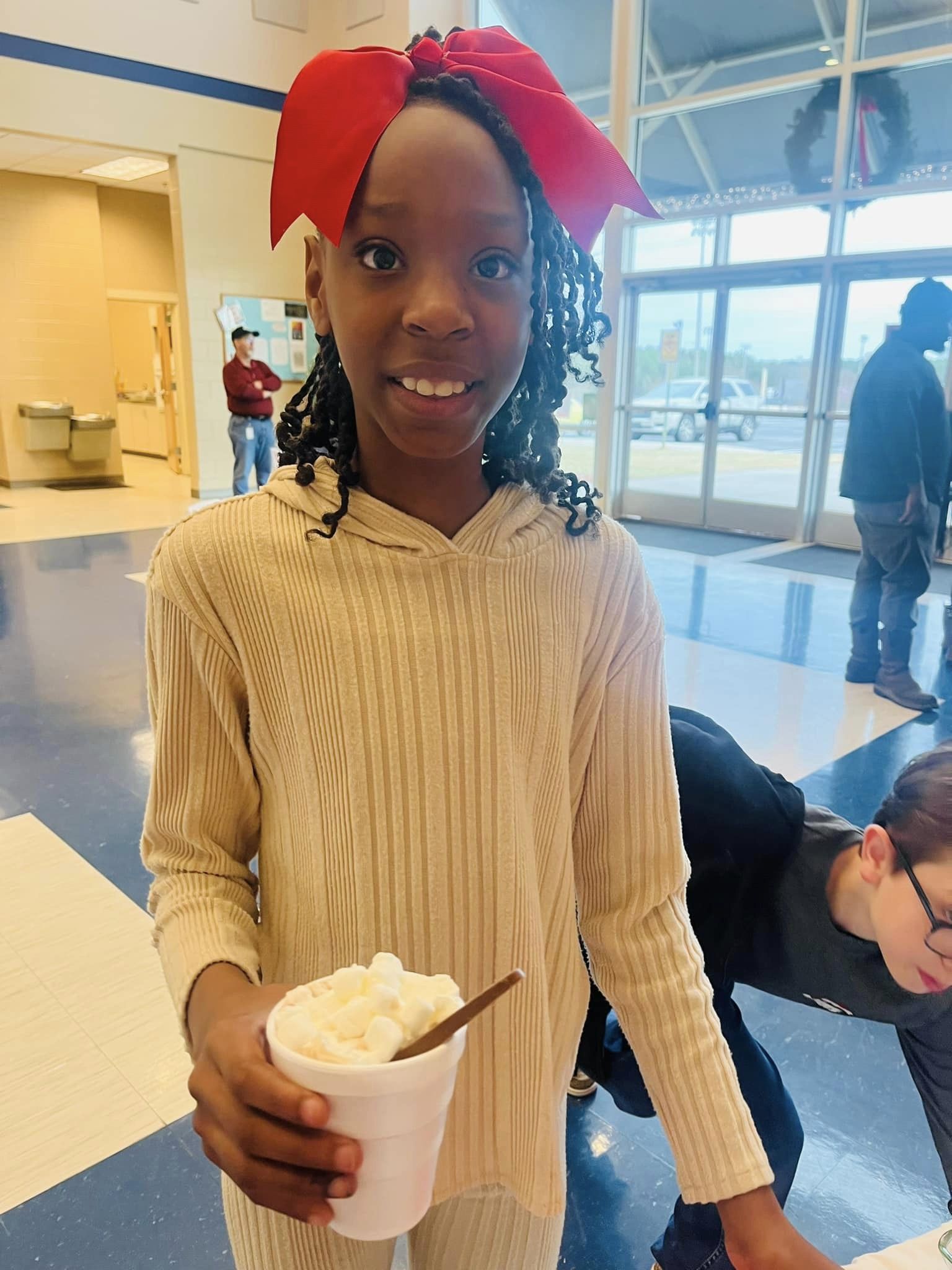 Little girl with a hot chocolate. 